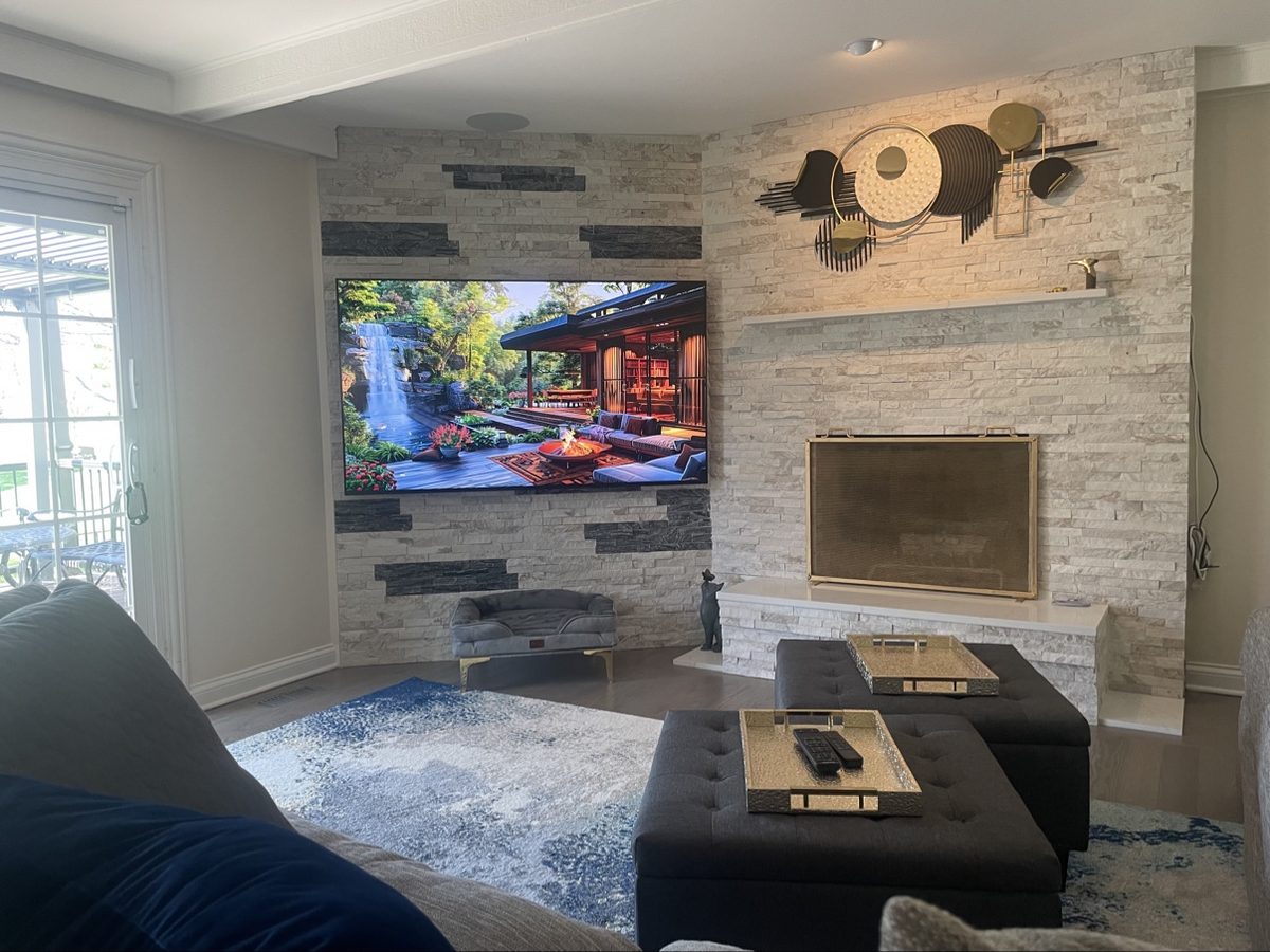 After: TV mounted on the finished stone fireplace feature wall
