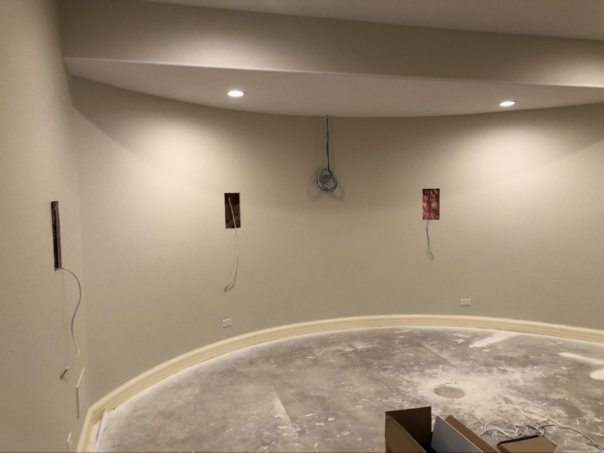 In-wall speaker pre-wire with cables pulled through open wall cutouts